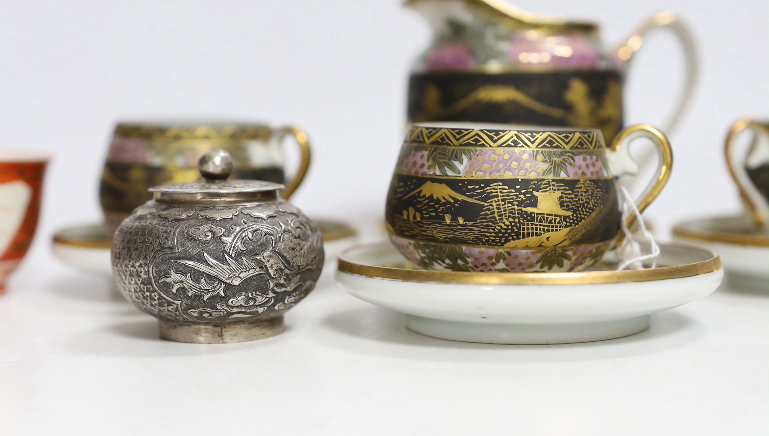 A Chinese white metal unsigned pot and cover, 5cm high, together with two Japanese Kutani tea bowls, 19th century and a Japanese egg shell part tea set